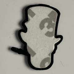 Pinkgul.no decorative metal sticker in the shape of a top hat, featuring a strong adhesive backing.