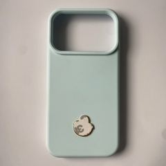 Pinkgul.no decorative metal sticker with a raised design applied to the back of a light blue smartphone case
