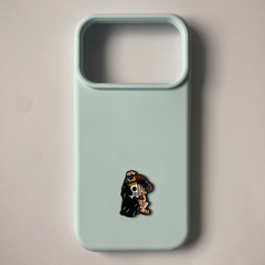 Pinkgul.no light blue phone case featuring a small, decorative metal sticker of a split skull and anime character design.