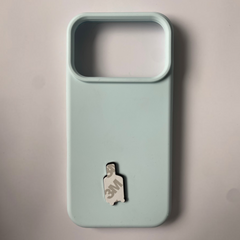 Pinkgul.no decorative metal sticker with 3M adhesive backing attached to a light blue smartphone case