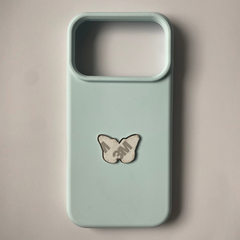 Pinkgul.no decorative metal butterfly sticker applied to a light blue smartphone case