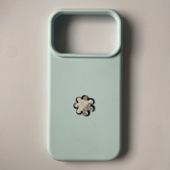 Pinkgul.no decorative metal flower sticker applied to a light blue smartphone case