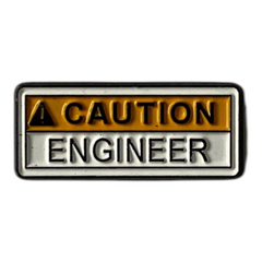Pinkgul.no decorative metal sticker with a raised Caution Engineer design in yellow and black for electronics