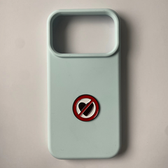 Pinkgul.no decorative metal sticker with a red and black no-heart symbol on a light blue phone case
