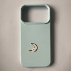 Pinkgul.no decorative gold crescent moon metal sticker applied to a light blue smartphone case