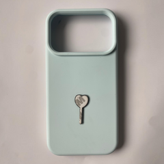 Pinkgul.no light blue silicone iPhone case featuring a small heart-shaped charm with the letter M