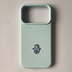 Pinkgul.no decorative metal Hamsa hand sticker applied to a light blue smartphone case