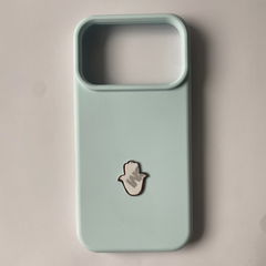 Pinkgul.no decorative metal Hamsa hand sticker applied to a light blue smartphone case