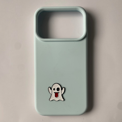 Pinkgul.no light blue phone case featuring a small, decorative metal ghost sticker with a red tongue.