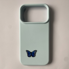 Pinkgul.no light blue phone case featuring a small, detailed, raised blue butterfly metal sticker