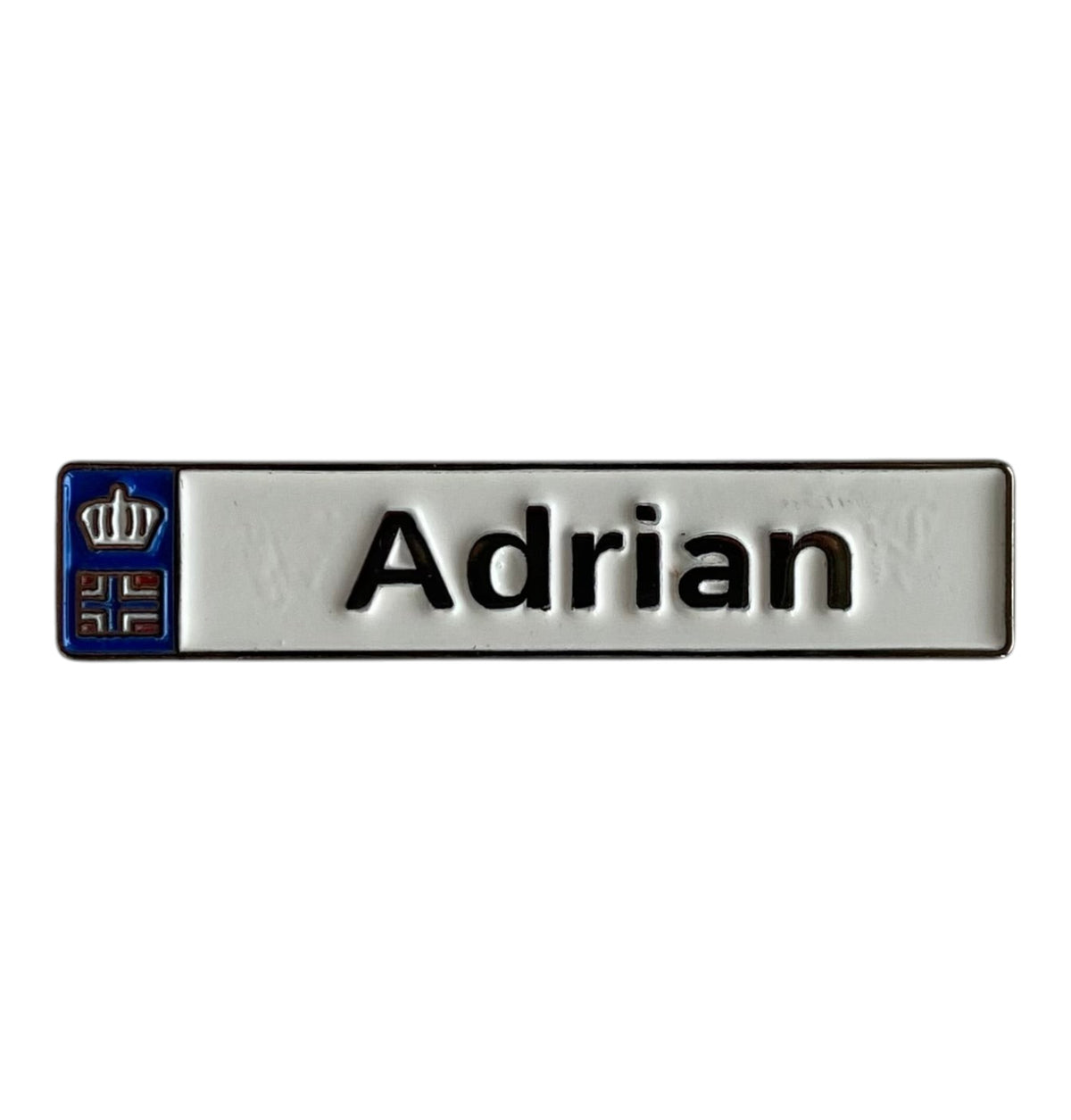 Pinkgul.no Adrian decorative metal sticker with a white surface, black text, and a small crown emblem on the left.