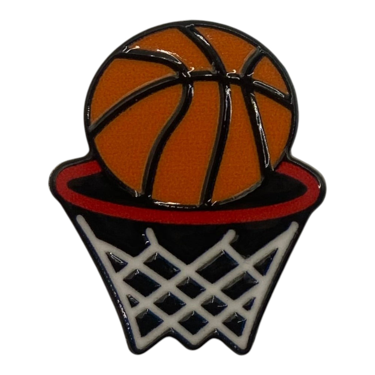 Pinkgul.no decorative metal sticker featuring an orange basketball going into a hoop on a white background