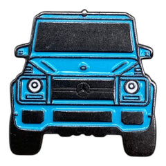 Pinkgul.no decorative metal sticker featuring a blue Mercedes G-Wagon SUV design with a smooth, raised finish.