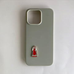 Pinkgul.no decorative metal sticker of a traditional Norwegian red bunad dress on a sage green phone case