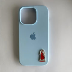 Pinkgul.no decorative metal sticker featuring a traditional red Bunad dress design applied to a light blue phone case