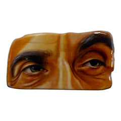 Pinkgul.no decorative metal sticker featuring a detailed, raised design of human eyes with a smooth, glossy finish.