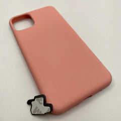 Pinkgul.no decorative metal sticker with adhesive backing placed next to a soft pink silicone phone case