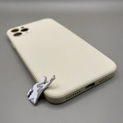 Pinkgul.no decorative metal sticker with a raised design placed next to a beige smartphone case