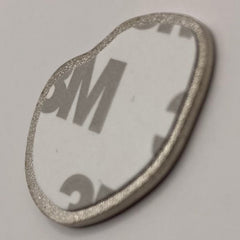Pinkgul.no decorative metal sticker with a raised design and strong adhesive backing on a white surface