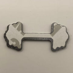 Pinkgul.no decorative metal sticker in a dumbbell shape with a smooth finish and strong adhesive backing.