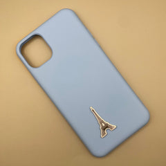 Pinkgul.no decorative gold metal Eiffel Tower sticker applied to a light blue smartphone case