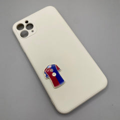 Pinkgul.no decorative metal sticker shaped like a FC Barcelona football jersey attached to a beige phone case