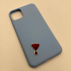 Pinkgul.no decorative metal sticker shaped like a red flower bouquet attached to a light blue smartphone case