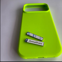 Pinkgul.no Jonathan decorative metal sticker with white finish and crown icon on a neon green phone case