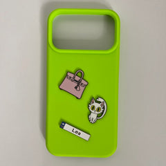Pinkgul.no Lea decorative metal stickers featuring a pink handbag and a white cat on a bright lime green phone case