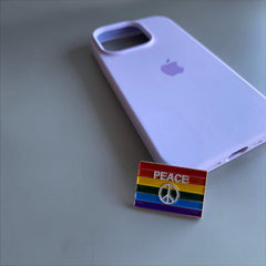 Pinkgul.no metal LGBT+ pride peace sign sticker on a light purple phone case
