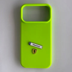 Pinkgul.no lime green phone case featuring a custom Hanna metal name sticker and a small prancing horse emblem.