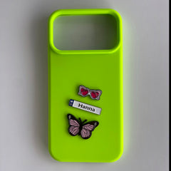 Pinkgul.no lime green phone case decorated with Hanna name tag, pink heart sunglasses, and butterfly metal stickers