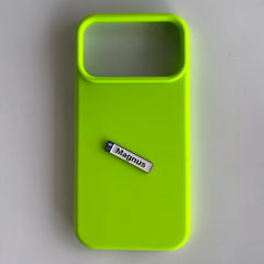 Pinkgul.no Magnus decorative metal sticker with a raised design placed on a bright neon green phone case