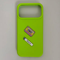 Pinkgul.no Maria decorative metal sticker and cassette tape sticker applied to a bright lime green phone case
