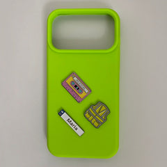 Pinkgul.no Maria decorative metal stickers on a neon green phone case featuring a cassette tape and safety vest