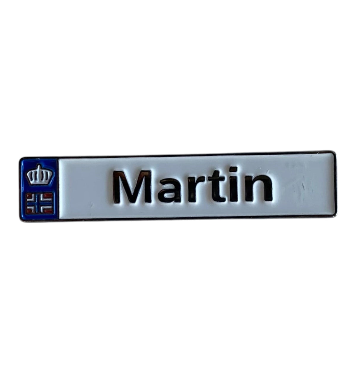 Pinkgul.no Martin decorative metal sticker with a white background, black text, and a small blue crown emblem.