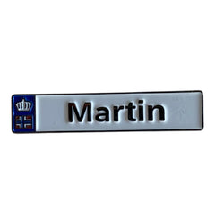 Pinkgul.no Martin decorative metal sticker with a white background, black text, and a small blue crown emblem.