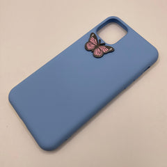 Pinkgul.no decorative metal butterfly sticker attached to a smooth light blue smartphone case