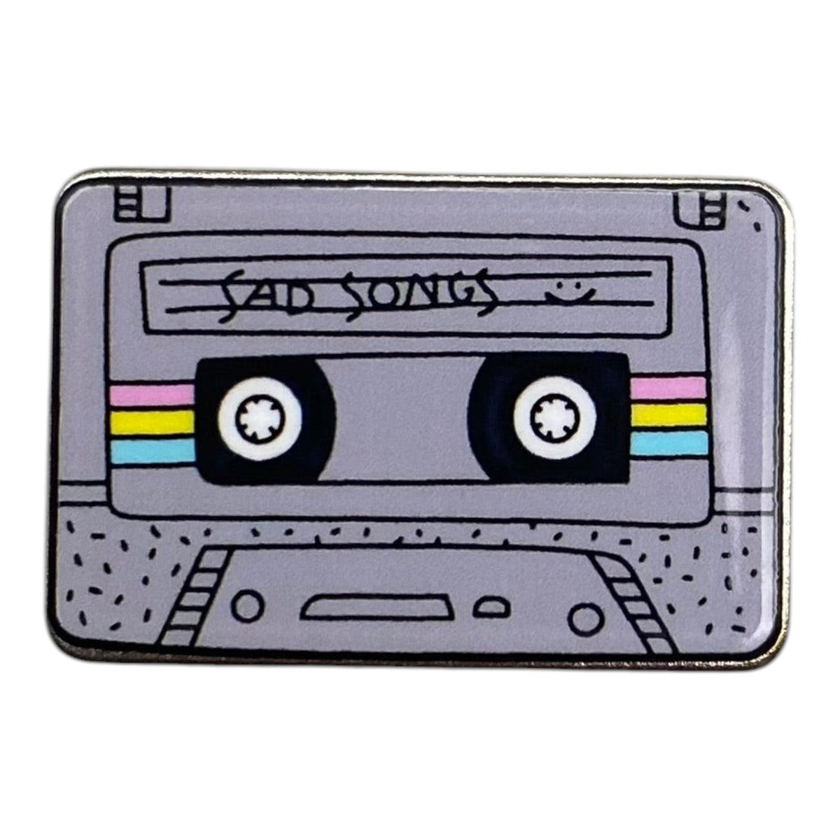 Pinkgul.no decorative metal sticker featuring a grey retro cassette tape design with Sad Songs text and colorful stripes