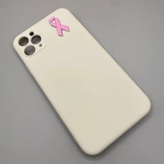 Pinkgul.no decorative metal pink ribbon awareness sticker applied to the back of a beige smartphone case