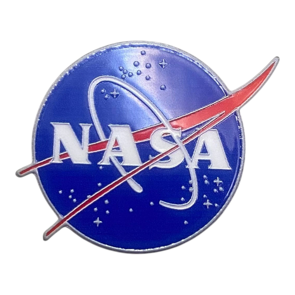 Pinkgul.no decorative metal NASA logo sticker with a raised design and blue, white, and red finish.