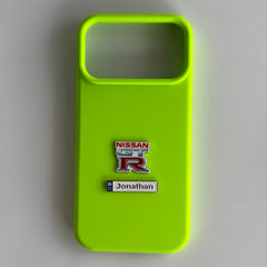 Pinkgul.no neon green phone case featuring a Nissan GT-R emblem and a personalized Jonathan metal sticker