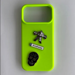 Pinkgul.no neon green phone case decorated with Andreas metal sticker, a weightlifter, and a skull emblem.