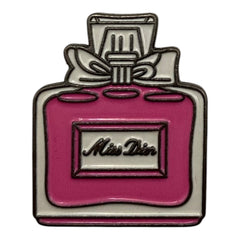 Pinkgul.no decorative metal sticker shaped like a pink and white perfume bottle with a bow and Miss Dior text