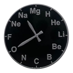 Pinkgul.no decorative metal sticker featuring a circular periodic table design with chemical elements and clock hands