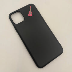Pinkgul.no decorative metal sticker shaped like a pink guitar applied to a black smartphone case