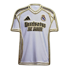 Pinkgul.no decorative metal sticker shaped like a white Real Madrid football jersey with gold and black details.