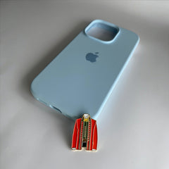 Pinkgul.no decorative red jacket metal sticker on a light blue phone case
