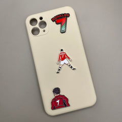 Pinkgul.no decorative metal stickers featuring Cristiano Ronaldo designs applied to a cream-colored phone case.