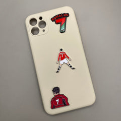 Pinkgul.no decorative metal stickers featuring Cristiano Ronaldo designs applied to a cream-colored phone case.